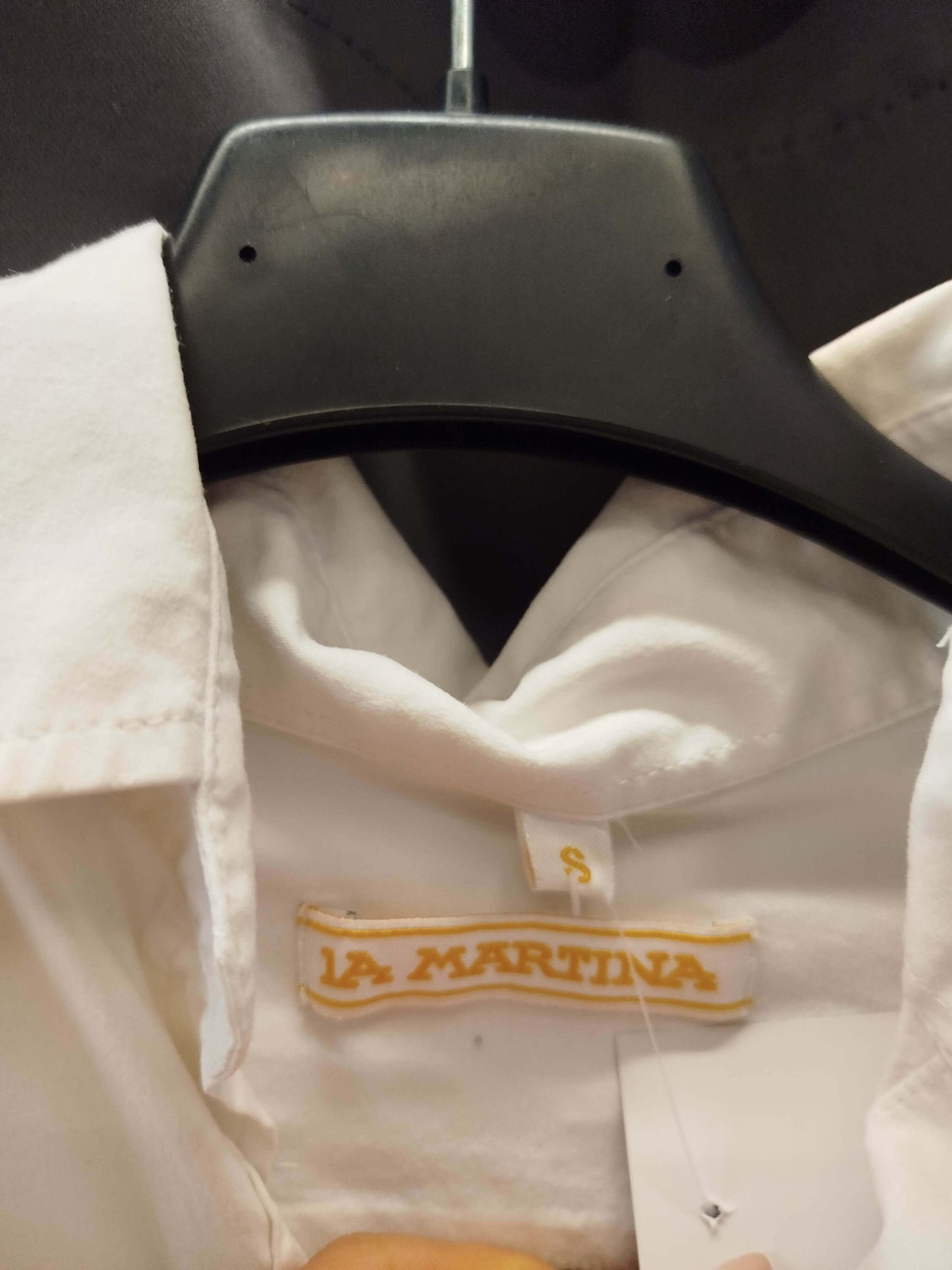 Close-up of La Martina shirt label in size S, showcasing high-quality craftsmanship and attention to detail.
